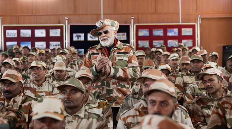 https://newsfirstprime.com/wp-content/uploads/2023/11/Modi-Diwali-with-soldiers.jpg